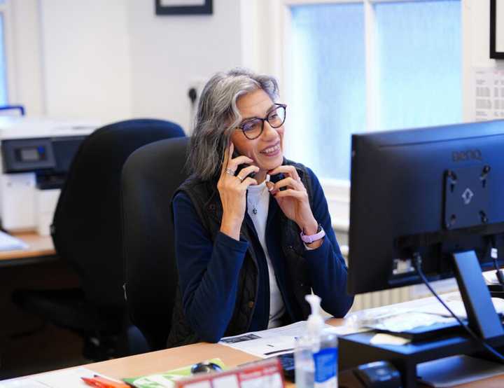 Photo of Vet Receptionist Ann using the telephone